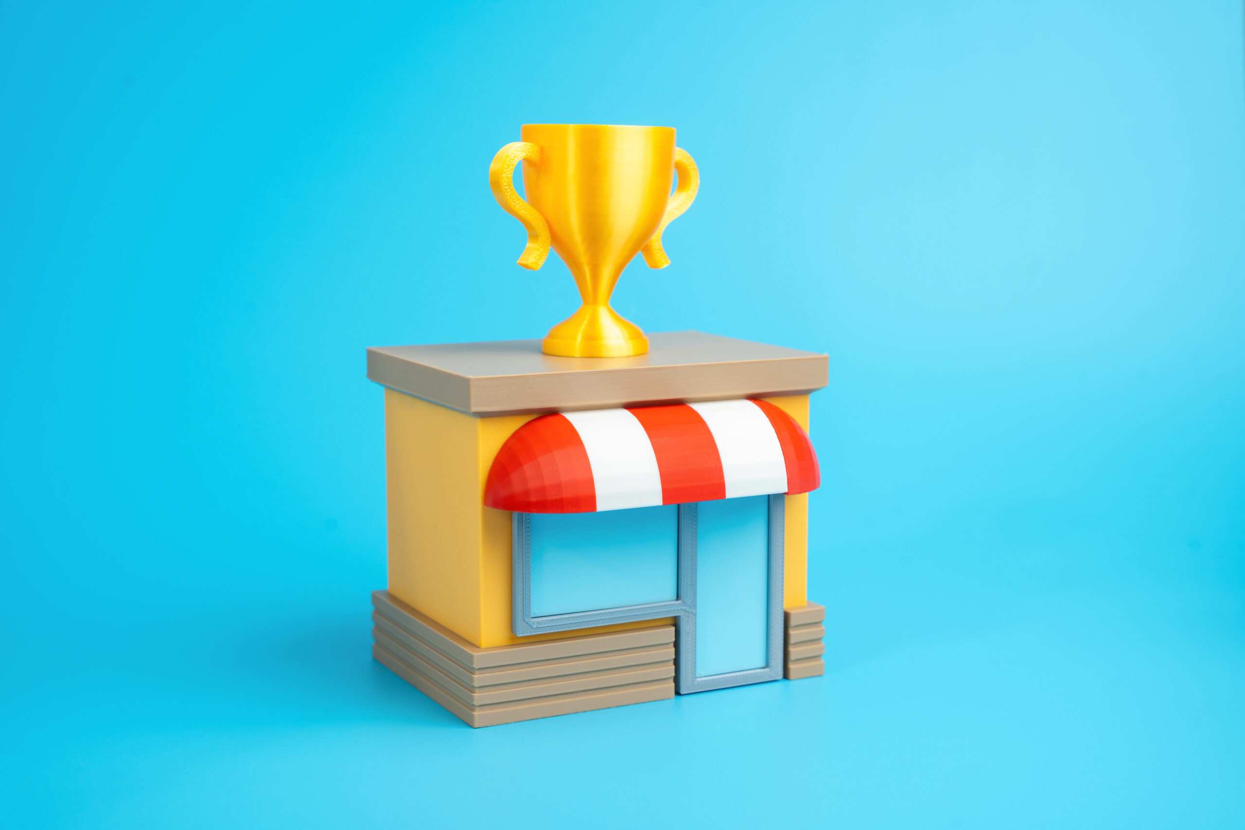 a store with a gold winner's cup. best store or business. high sales performance