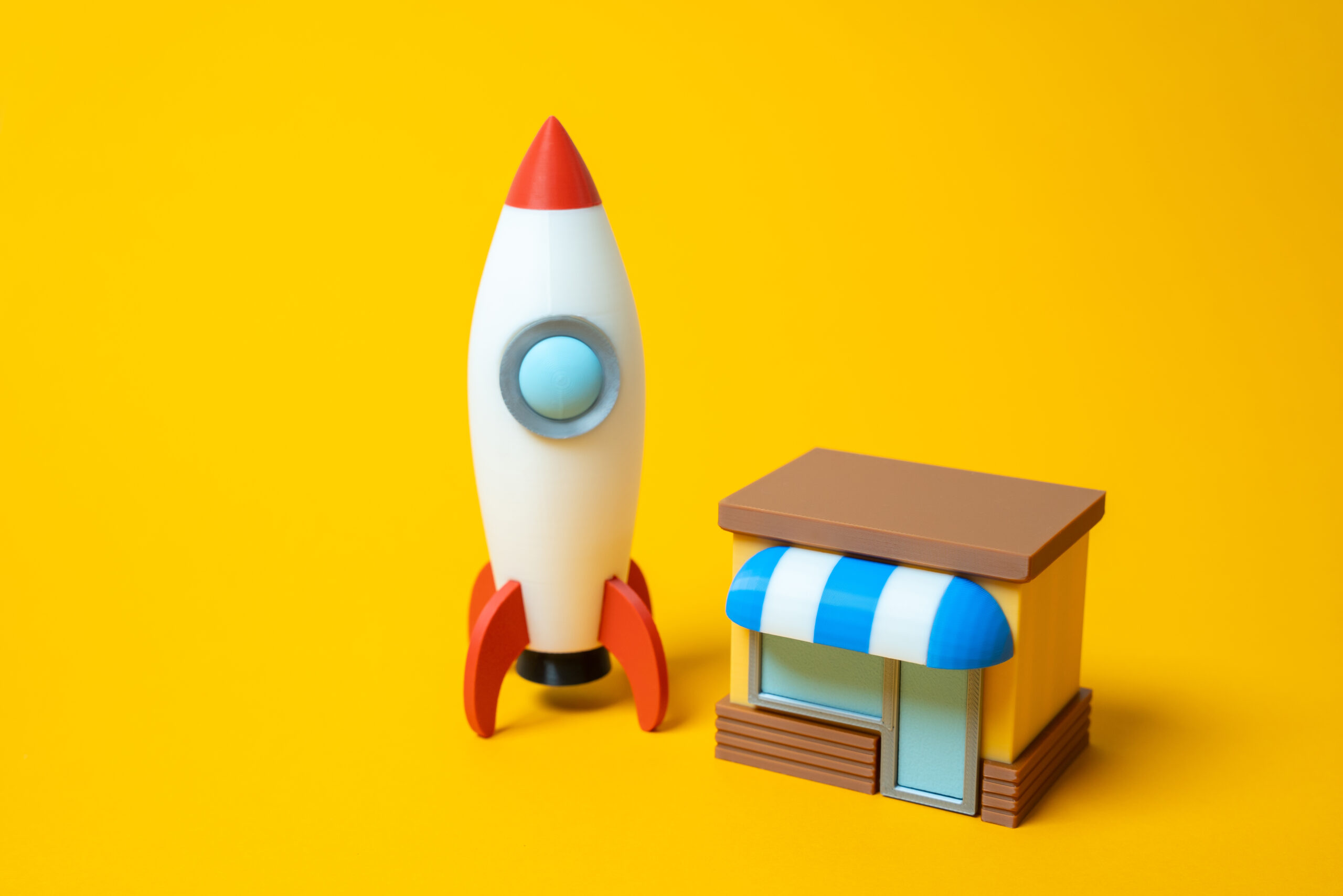 store building and rocket. advertising and targeting. open a startup or your own business